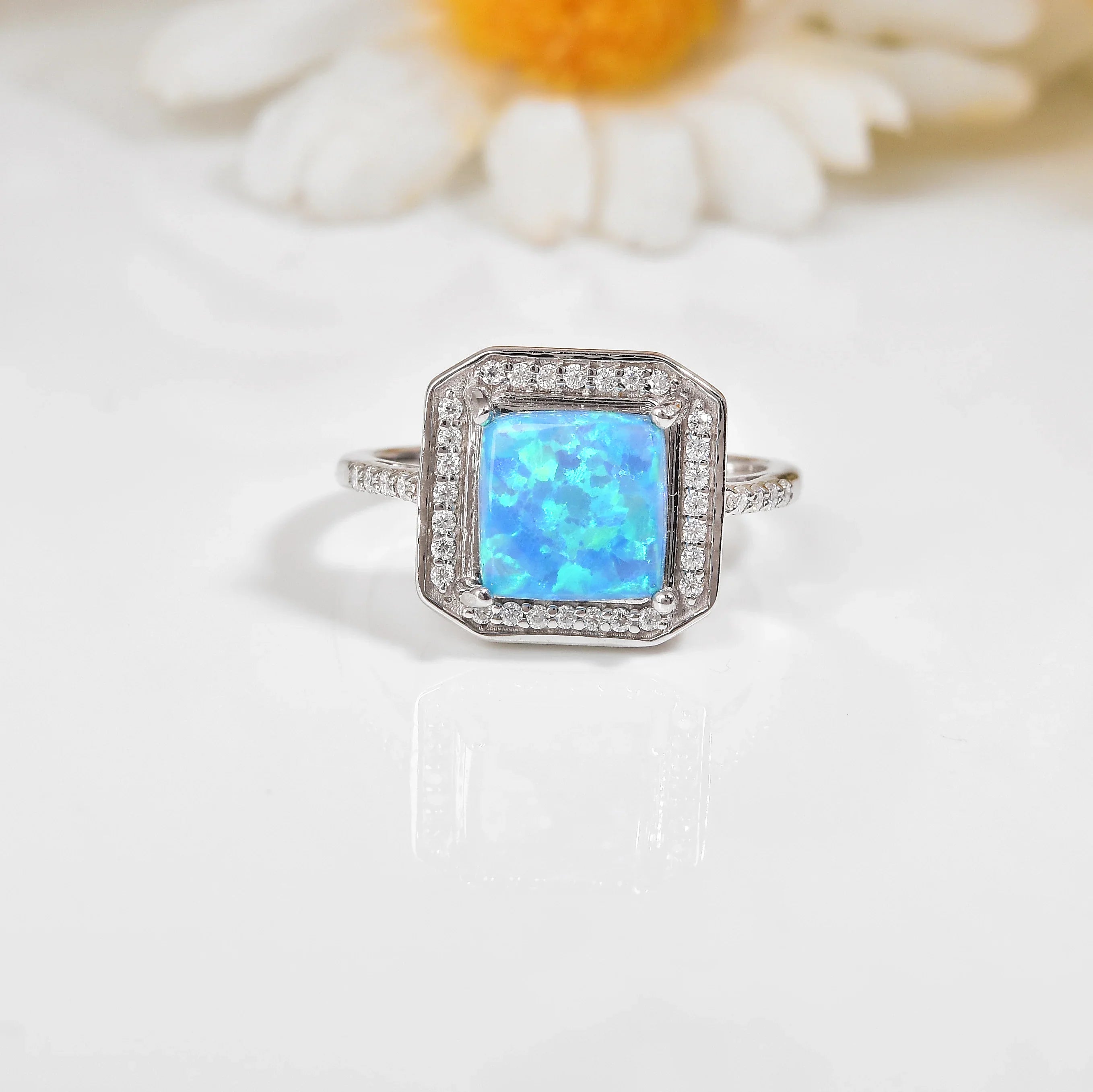 Lab Created Blue Opal Halo Ring Fine Color Jewels created opal ring, NOURRI, october birthstone ring, october jewelry, october jewelry for women, opal birthstone ring, opal engagement rings for women, opal gifts for women, opal gold rings, opal halo engagement ring, opal jewelry for women, opal jewelry sterling silver, opal promise ring, opal ring, opal ring for women, opal ring sterling silver, opal rings for women sterling silver, opal wedding ring, opal wedding rings for women, silver ring opal