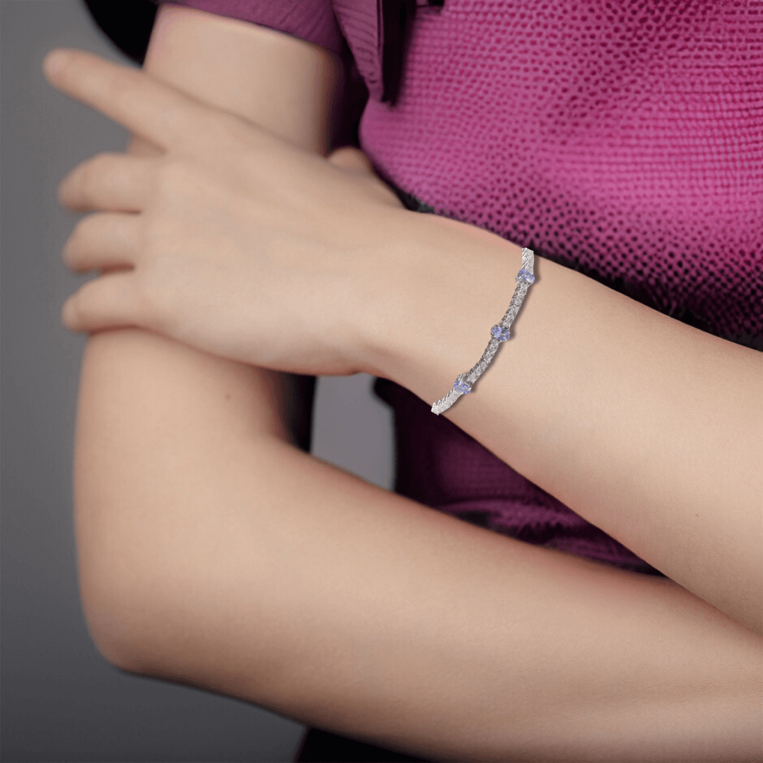 Elegant model hand showcasing the intricate details of our Blue Tanzanite Tennis Bracelet Sterling Silver Tennis Bracelet for Women Adjustable Tanzanite Gemstone Beaded Bracelet