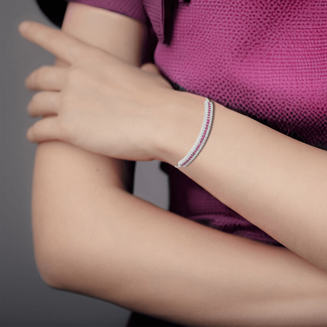 Elegant model hand showcasing the intricate details of our Ruby & White Topaz Cuff Bracelet in 925 Sterling Silver Ruby Cuff Bracelet for Women Wedding Bracelet