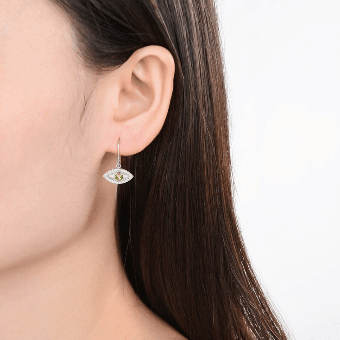 model showcasing Evil Eye Earrings Dangle Earrings Evil Eye Peridot Earrings