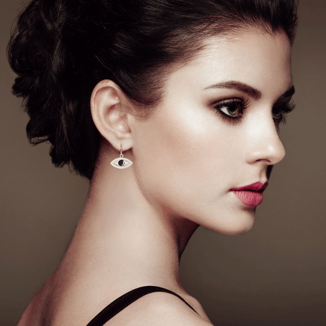 model showcasing Evil Eye Earrings Blue Sapphire Earrings