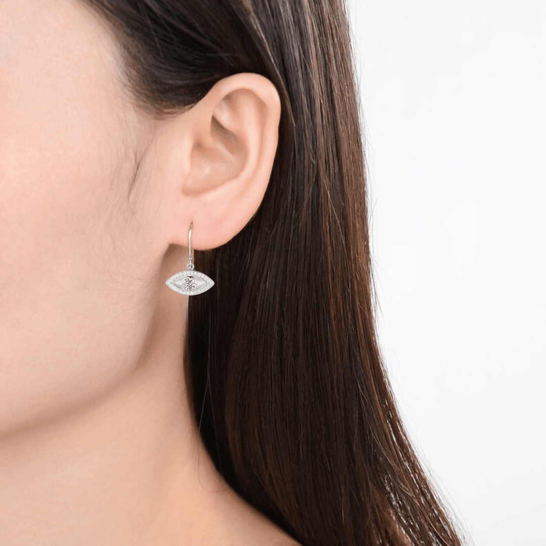 model showcasing Evil Eye Earrings Natural White Topaz Evil Eye Protection Earrings