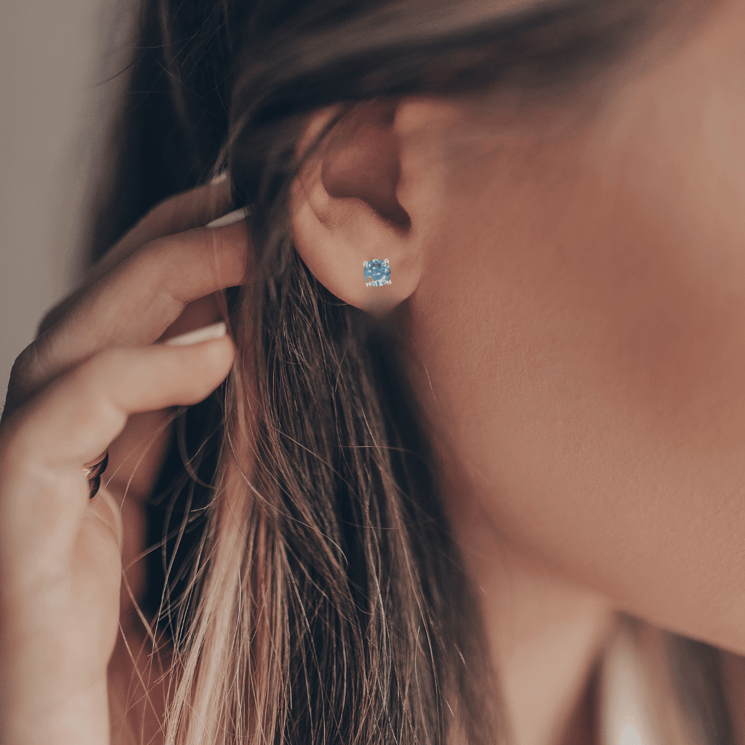 Model showcasing blue Moissanite Minimalist Stud Earrings
