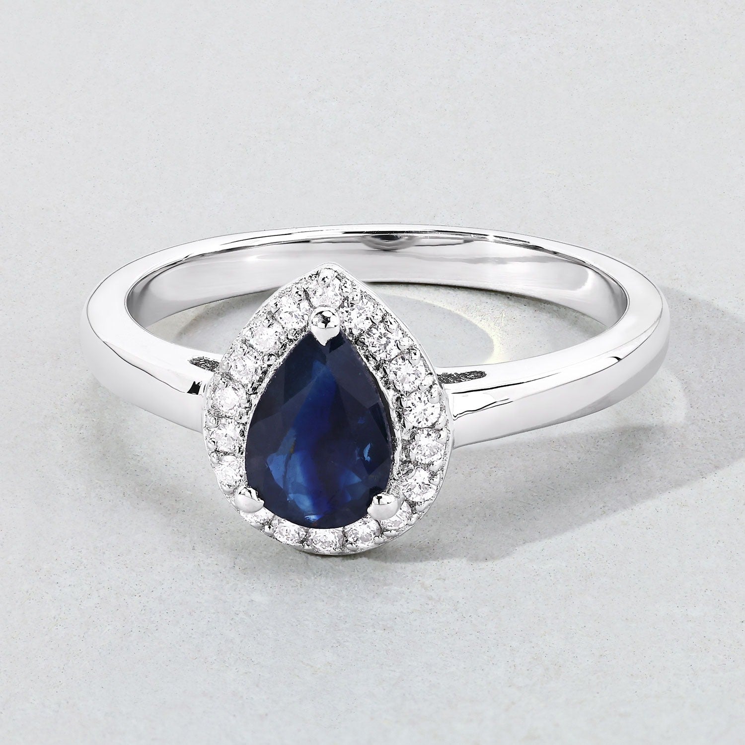 0.80 Ct Pear Blue Sapphire & Lab Diamond Prong Silver Halo Ring