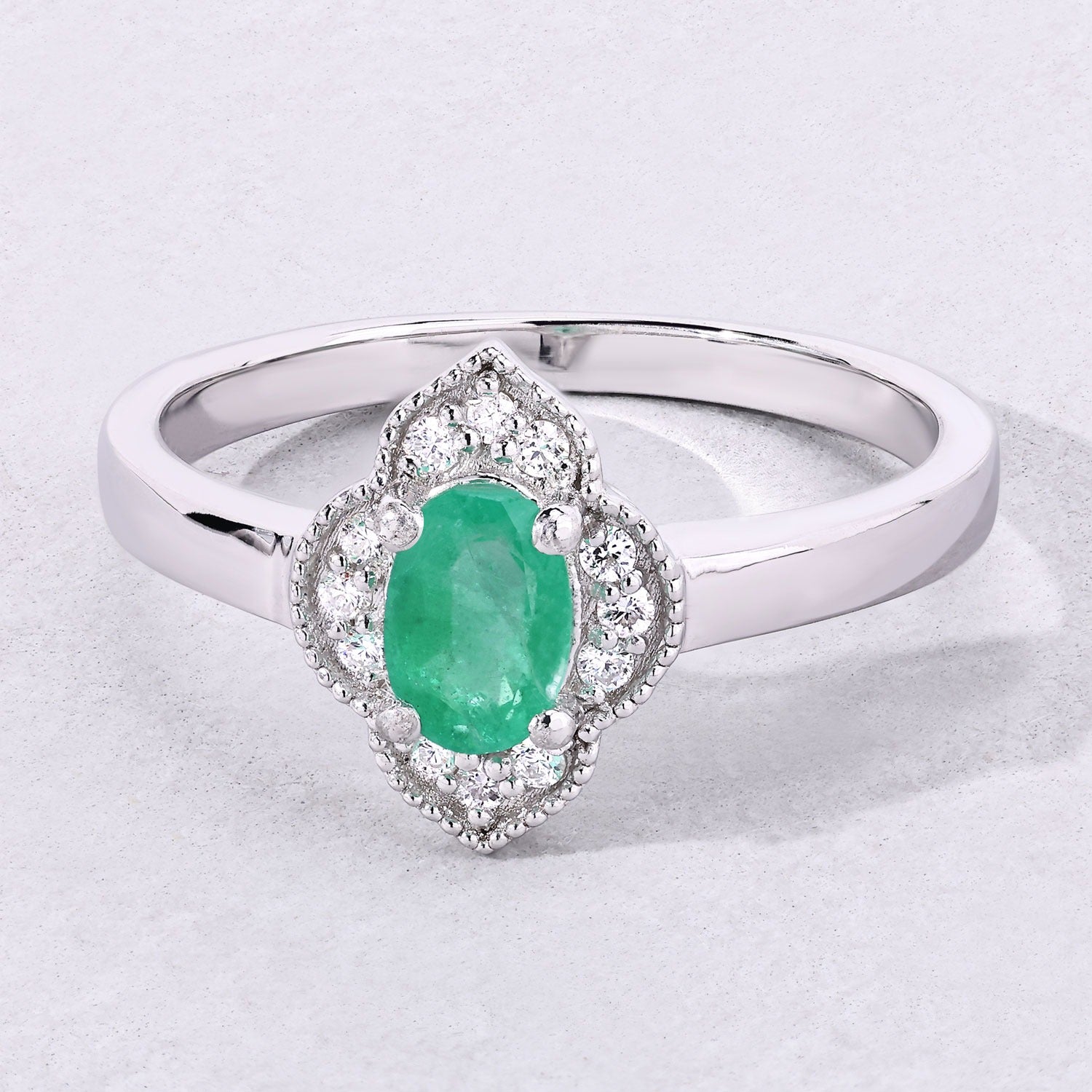 0.44 Ct Oval Green Zambian Emerald & Lab Diamond Prong Silver Floral Halo Ring