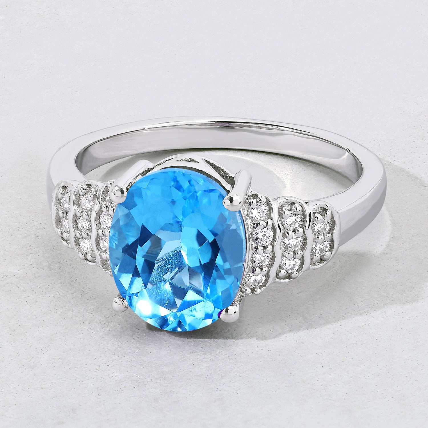 2.55 Ct Oval Swiss Blue Topaz & Lab Diamond Prong Silver Bridge Ring