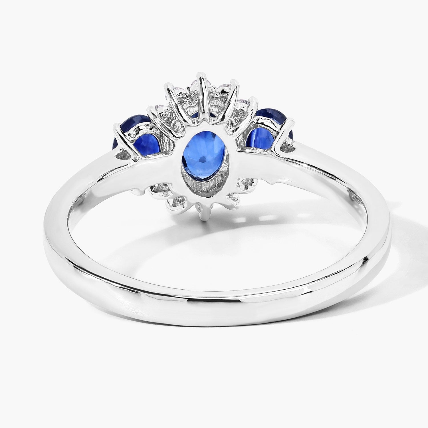 0.99 Ct Oval Blue Sapphire and Lab Diamond Prong Silver Three Stone Cocktail Ring