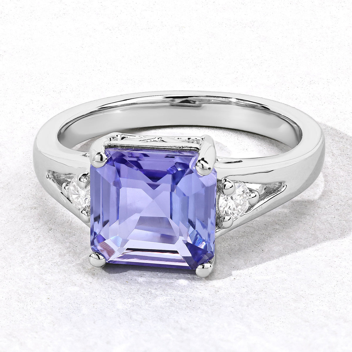 3.28 Cttw Octagon Violet Tanzanite and Lab Diamond Rhodium over Silver 3-Stone Ring