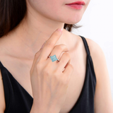 model in apatite ring, blue paraiba tourmaline ring, October birthstone ring 