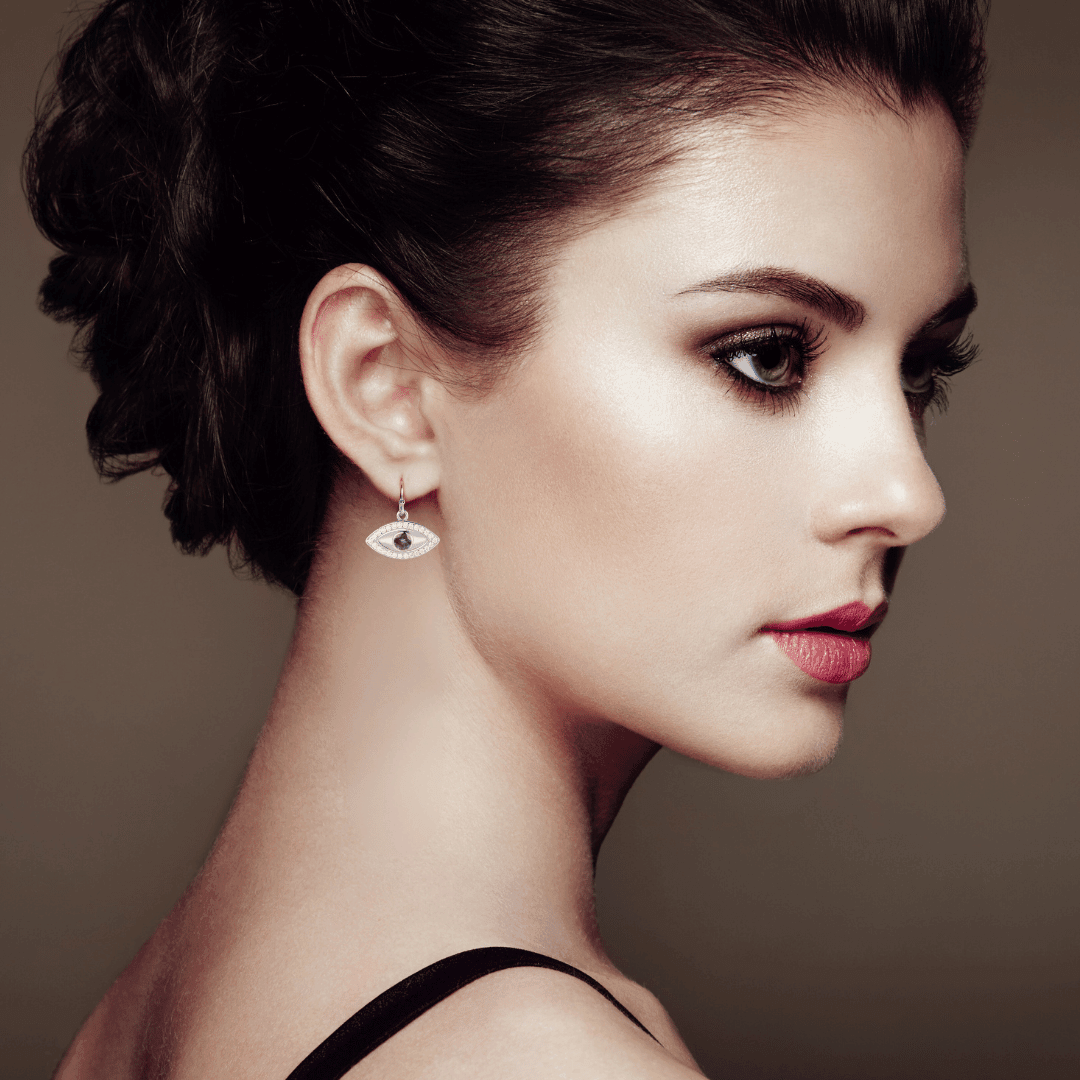 model showcasing Alexandrite Evil Eye Protection Earrings Alexandrite Dangling Earrings Rhodium Plated Silver Earrings