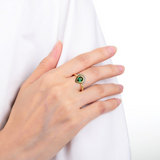 Model wearing chrome diopside ring, deep green gemstone ring, pear shape gemstone ring design