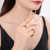 Model in garnet solitaire ring, model in cushion solitaire ring