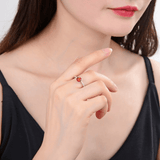 Model wearing sapphire ring, sapphire solitaire peach color ring, model in solitaire ring