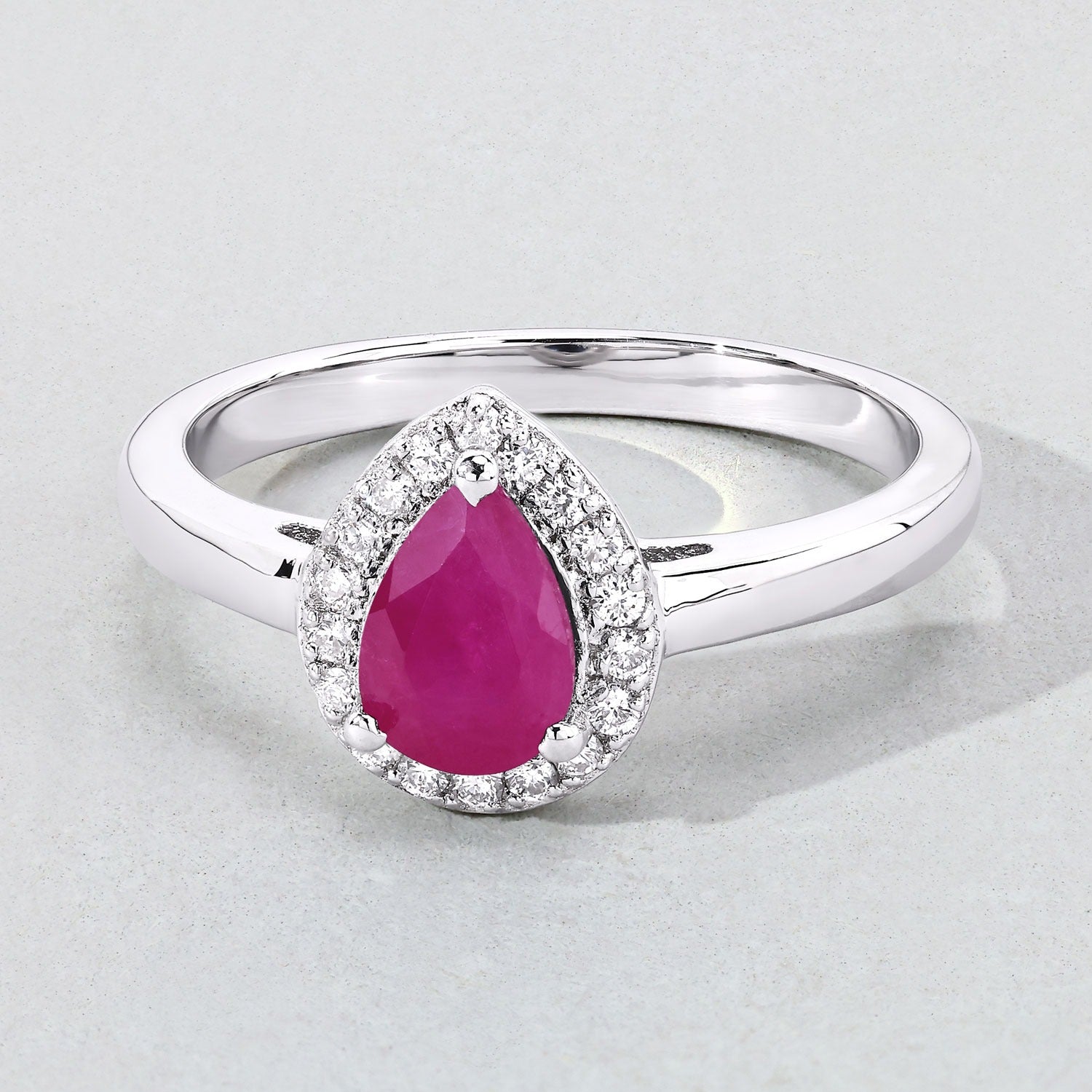 0.94 Ct Pear Pink Ruby and Lab Diamond Sterling Silver Prong Halo Ring