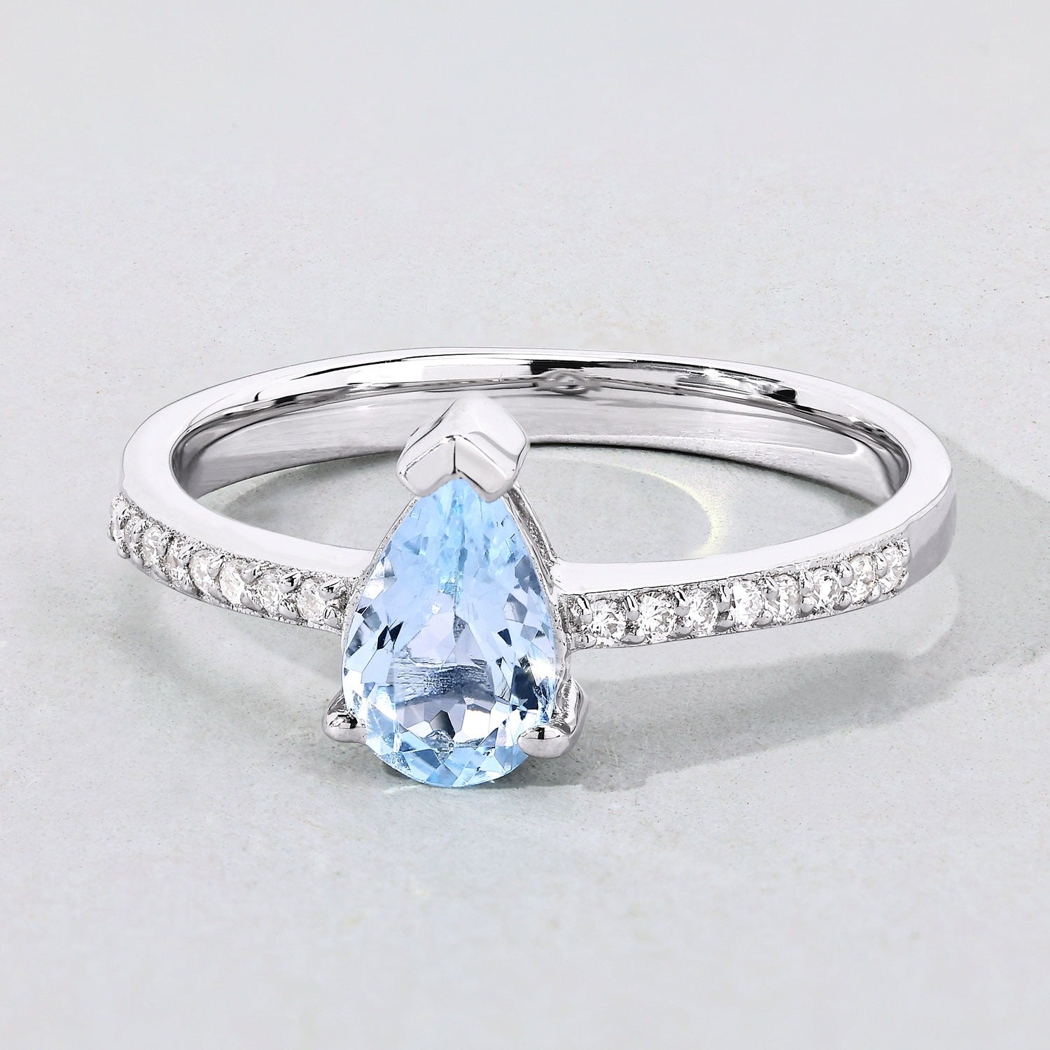 0.80 Ct Pear Blue Aquamarine and Lab Diamond V-Prong Silver Pave Bridge Ring