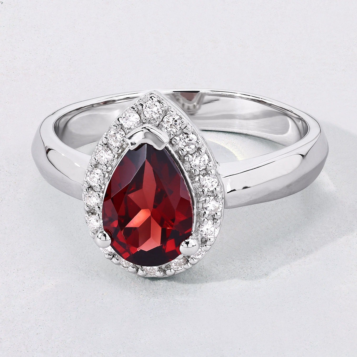 1.30 Ct Pear Red Mozambique Garnet & Lab Diamond Prong Silver Halo Ring