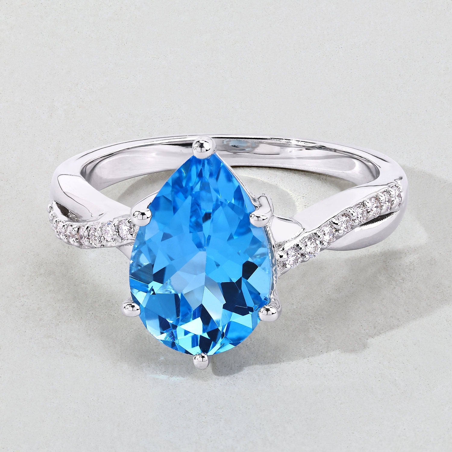 3.50 Ct Pear Swiss Blue Topaz & Lab Diamond Prong Silver Pave Bypass Ring