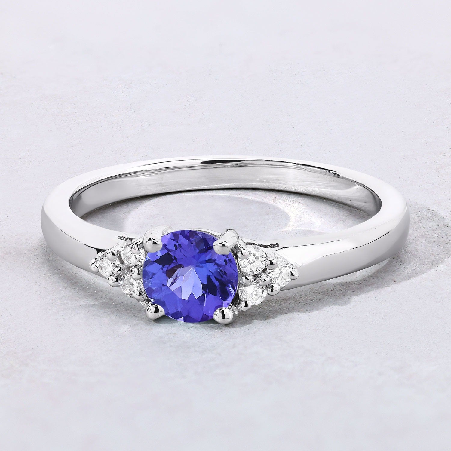 0.56 Ct Genuine Tanzanite and Lab Diamond Silver Round Ring