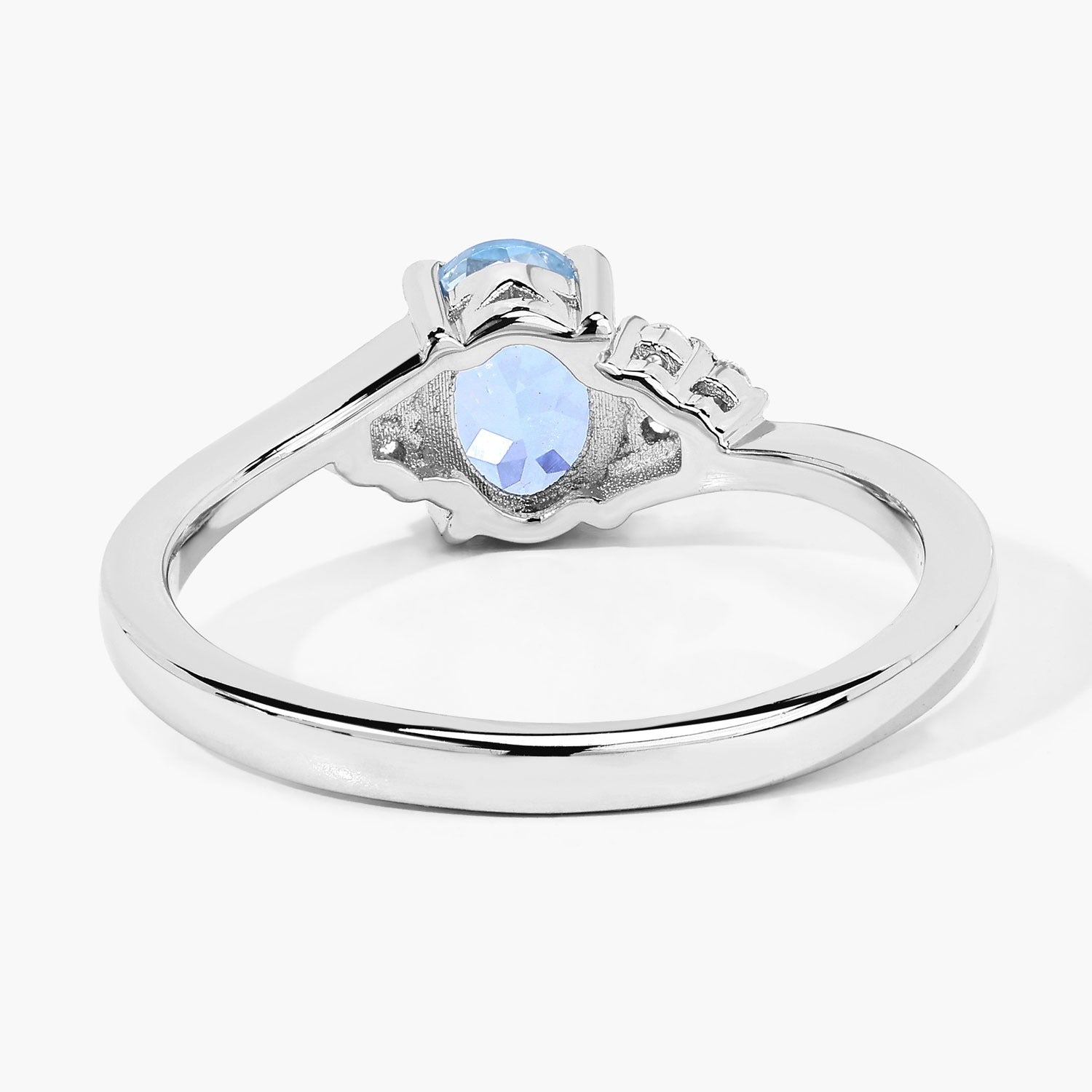 0.60 Ct Oval Blue Aquamarine and Lab Diamond Prong Sterling Silver Bypass Ring