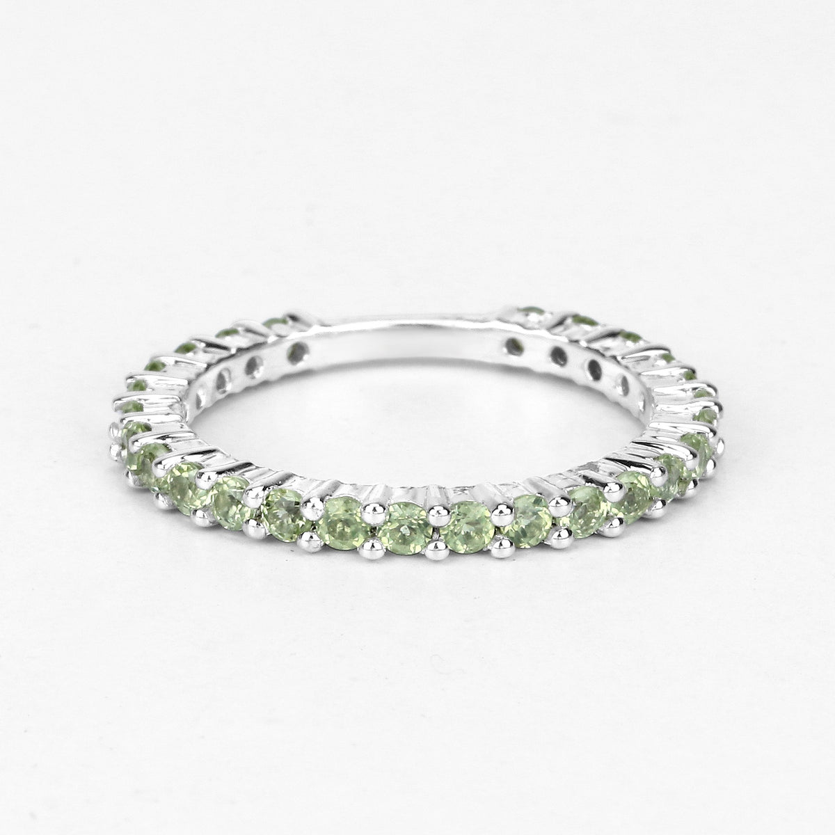 0.91 Ct Round Light Green Peridot Rhodium Over 925 Sterling Silver Eternity Band Ring